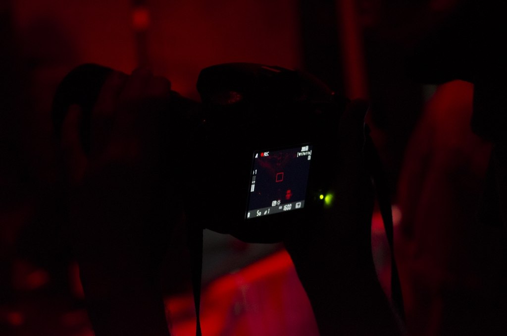 Someone filming a gig on a DSLR